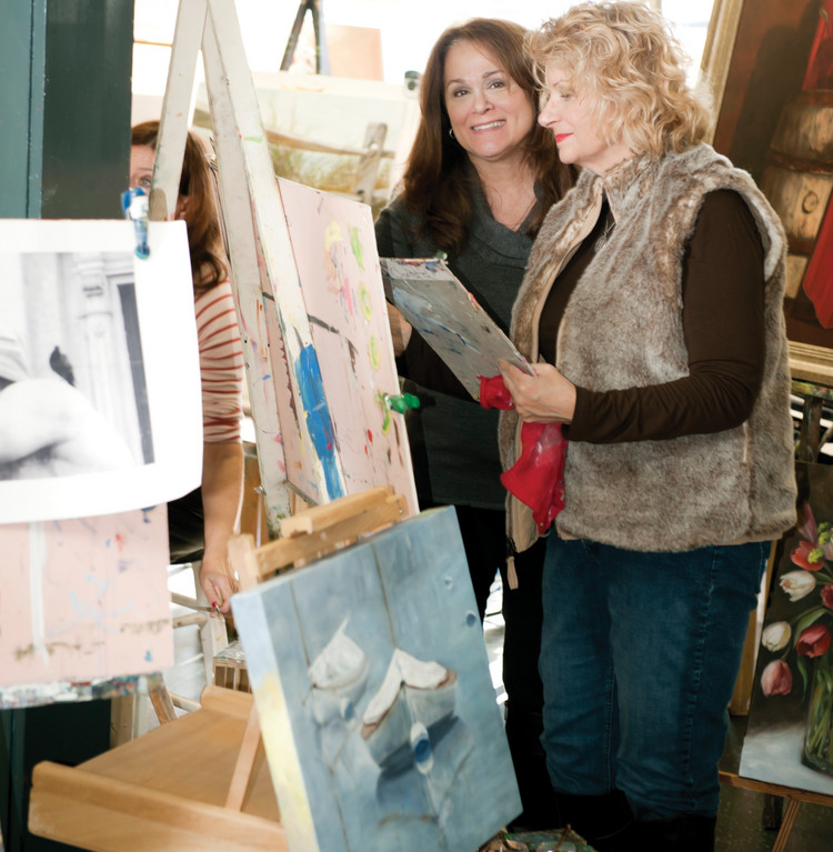 Nancy Scelsa (left) runs an oil painting class at the Nancy Stephen Gallery in East Greenwich