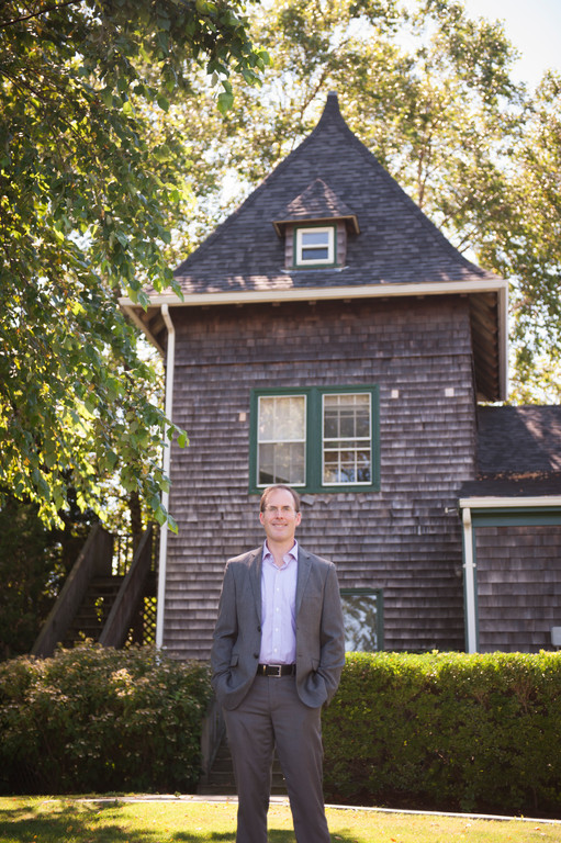 Dr. Wells at a 19th century structure original to Ferrycliff Farm,
which is now the present-day Roger Williams campus