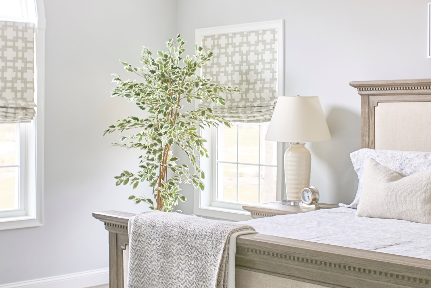 Linen shades with blue trim infuse the bright space with seaside 
appeal while connecting with other like-colored elements from furniture to textiles to artwork