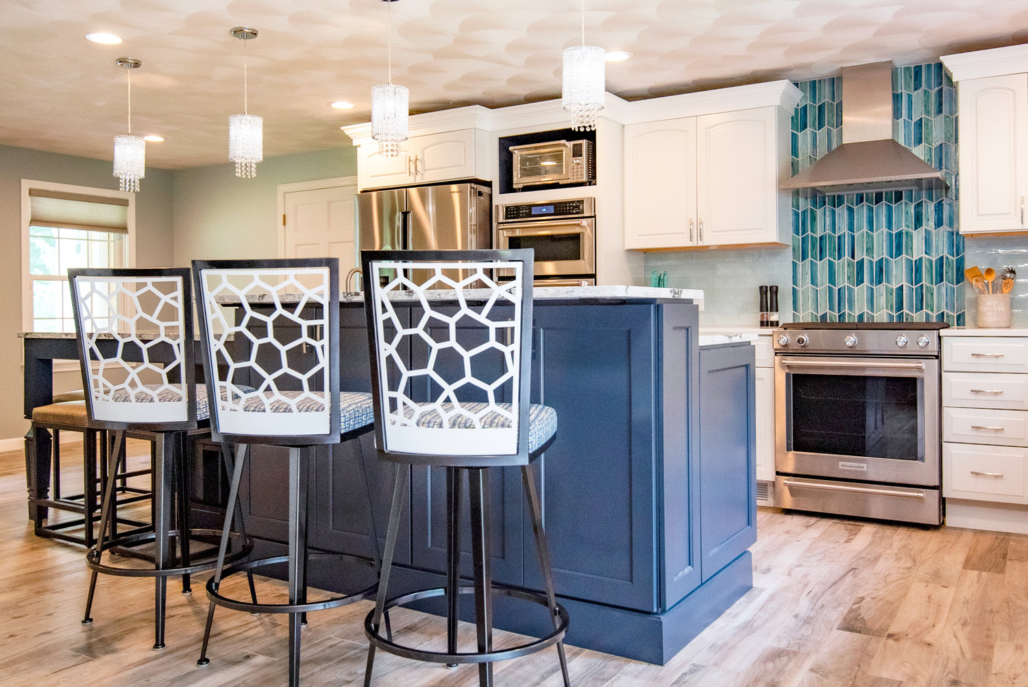 A trio of custom bar stools adds unexpected panache