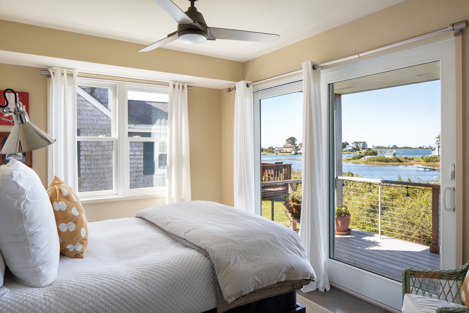 Barely-there window treatments allow for unobstructed views year-round