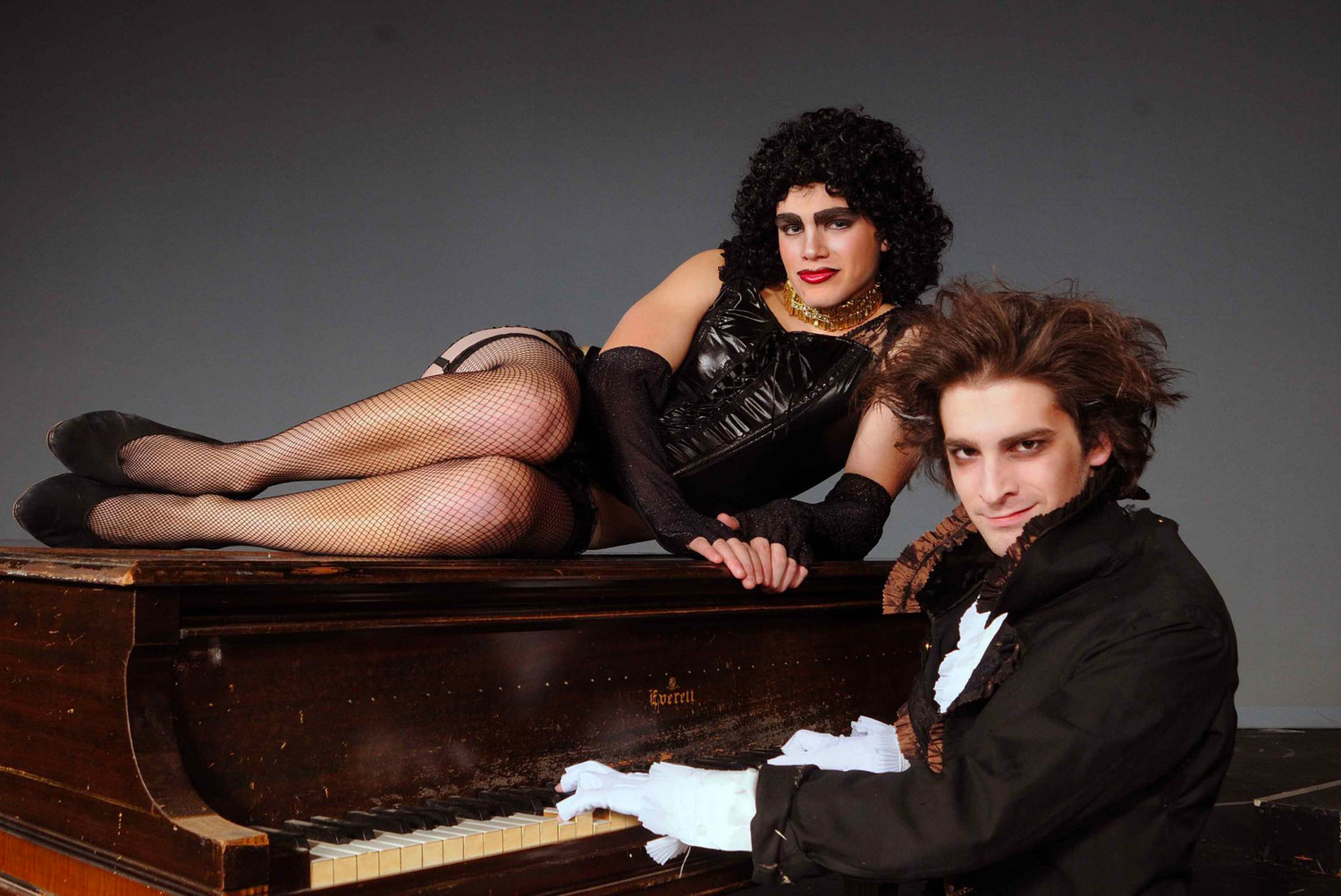 Perched on piano, Burnap performs in a 2010 production of The Rocky Horror Picture Show as Dr. Frank-N-Furter, opposite Johnny Sederquist