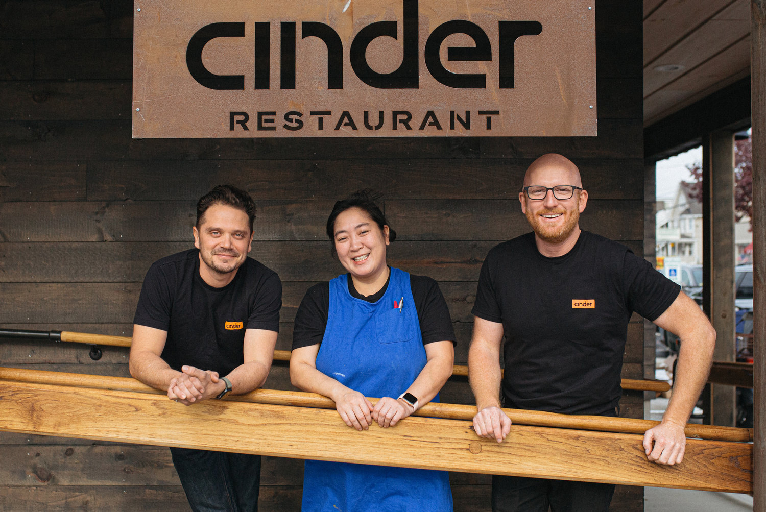 Cinder co-owners (L-R) Sam Agnello Jr. and Rory Douthit flank chef Maria Trager
