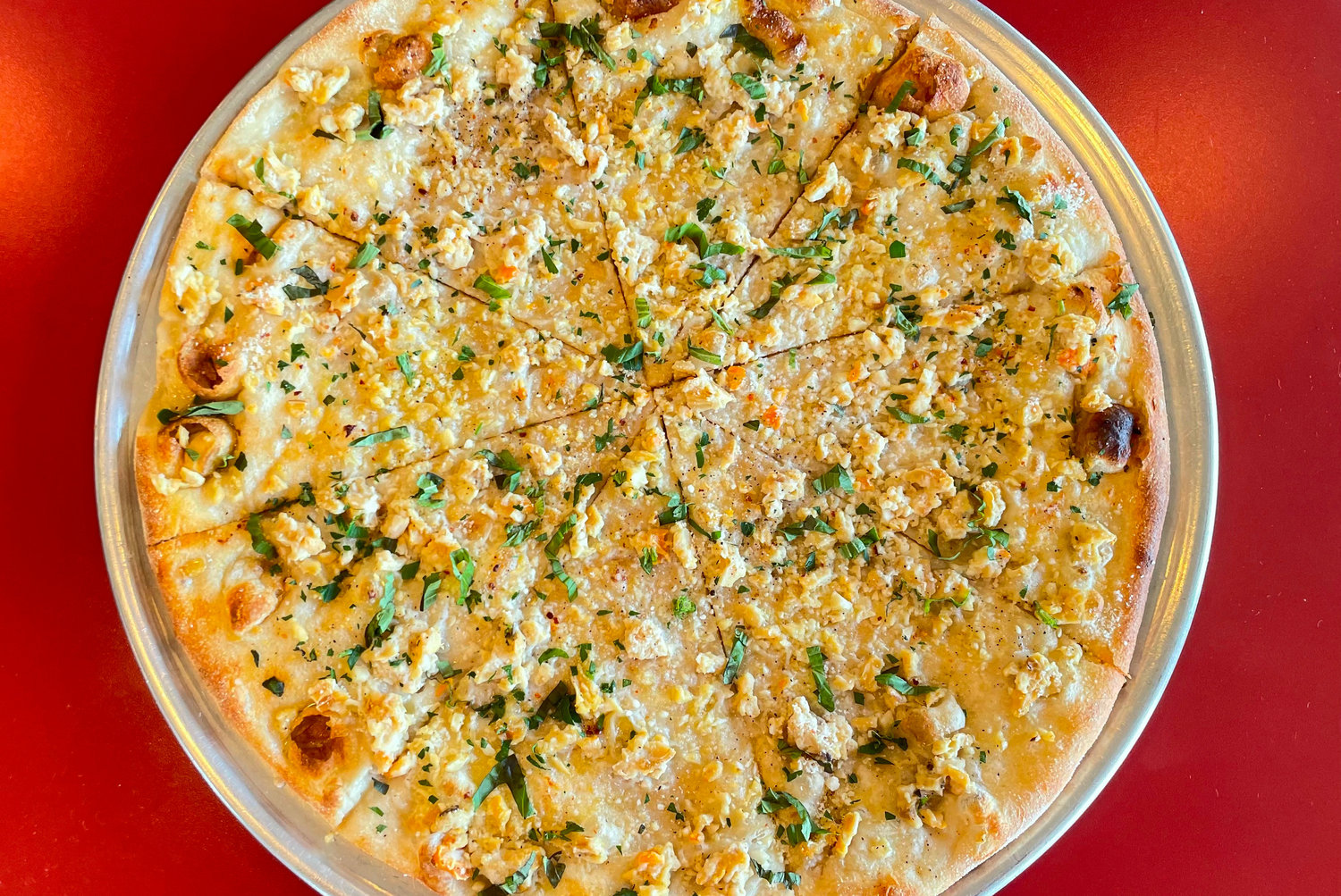 Add a briny clam pizza to your must-list of summer food staples