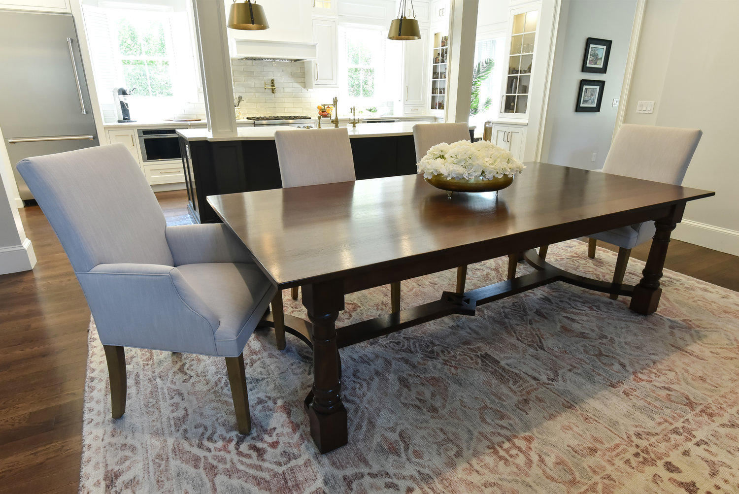 The walnut dining table was a design collaboration between Inside Style, their clients, and Matt Johnson, artisan/craftsman