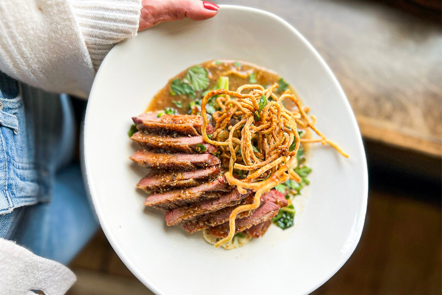 Honey Glazed Duck Breast served with crispy noodles at Duck Press